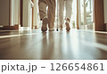 介護士と一緒に歩く高齢者の足元、温かい日差しの中の歩行訓練（介護・福祉） 126654861