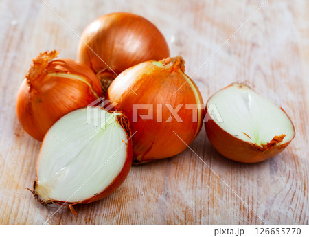 Fresh halved and whole onions 126655770