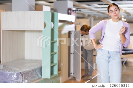 Couple choose new furniture in a store 126656315