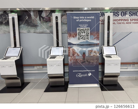 Self-service check-in kiosks at Penang Airport promoting digital convenience Self-service check-in kiosks at Penang Airport promoting digital convenience 126656613