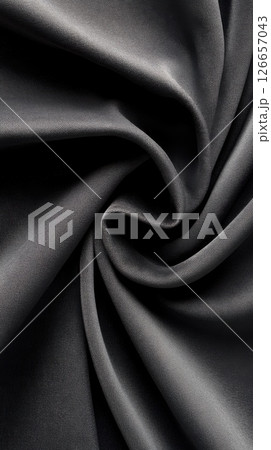 Soft velvet fabric contrasts with rough sandpaper in natural light at a dynamic angle 126657043