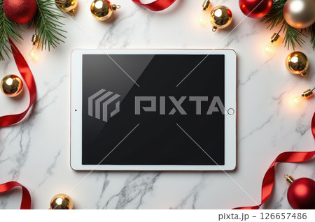 Festive christmas tablet display with ornaments and red ribbons for holiday cheer. AI generation 126657486
