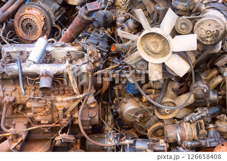 Rusty Engines and Various Mechanical Parts Found in a Scrap Yard Full of Discarded Items Rusty Engines and Various Mechanical Parts Found in a Scrap Yard Full of Discarded Items 126658408