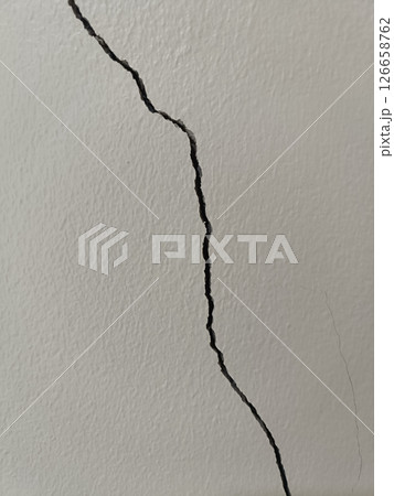 A wall crack is showing sign of structural problem and is cause for concern and immediate attention and it looks alarming 126658762