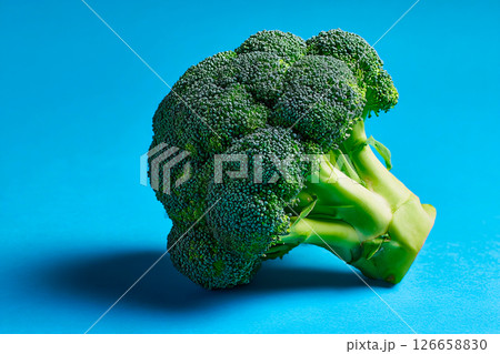 tempting broccoli in the industrial corner on a pastel blue background 126658830