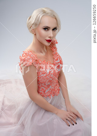 Stunning bride poses elegantly in a unique dress with a striking aesthetic 126659250