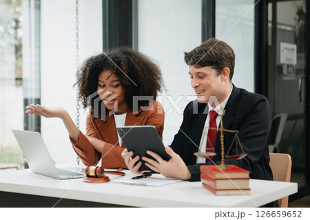 Business and lawyers discussing contract papers with brass scale on desk in office. Law, legal services, advice,  justice and law concept . 126659652
