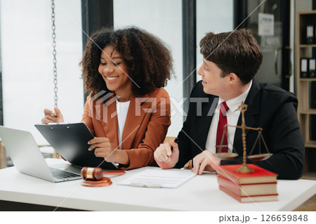 business team and lawyers discussing contract papers sitting at the table. Concepts of law, advice, legal services. at office 126659848