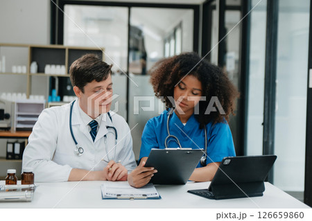 Medical technology network team meeting concept. Doctor hand working with smart phone modern digital tablet and laptop computer Medical technology network team meeting concept. Doctor hand working with smart phone modern digital tablet and laptop computer 126659860