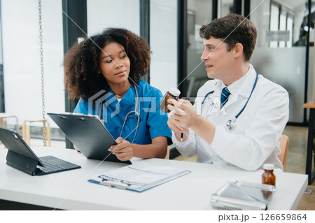 Medical technology network team meeting concept. Doctor hand working with smart phone modern digital tablet and laptop computer 126659864