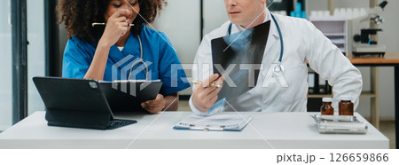 Medical technology network team meeting concept. Doctor hand working with smart phone modern digital tablet and laptop computer 126659866