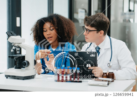 Medical Research Laboratory: Portrait of Two African American Scientists Working, Using Digital Tablet, Analyzing Samples, Talking. for Medicine, Biotechnology with VR icon 126659941