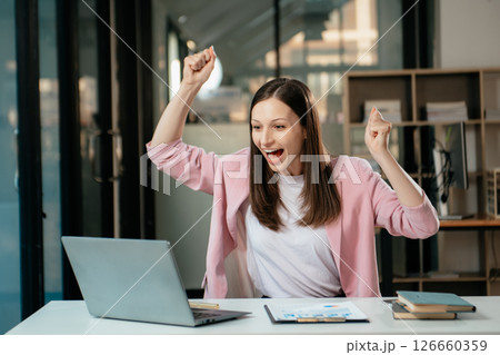Business expert attractive smiling young woman typing laptop and holding digital tablet Business expert attractive smiling young woman typing laptop and holding digital tablet 126660359