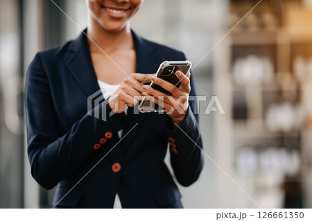 Working woman concept a female manager attending video conference and holding tablet, smatrphone and  cup of coffee in office 126661350