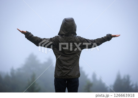 Woman enjoy the rainy forest in summer high altitude mountains 126663918