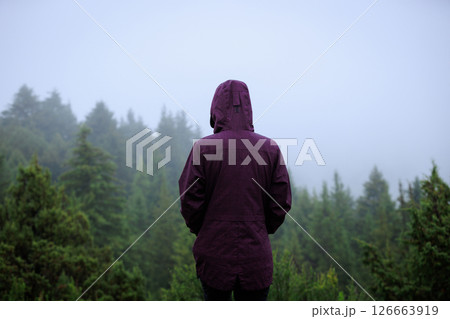 Woman enjoy the rainy forest in summer high altitude mountains 126663919
