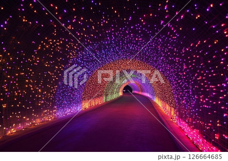 Colorful illuminated tunnel creates a stunning visual experience with shimmering lights in various hues 126664685