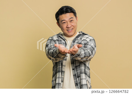 Asian man opening hands free gifts presents for you charity donation sharing love surprise award Asian man opening hands free gifts presents for you charity donation sharing love surprise award 126664782