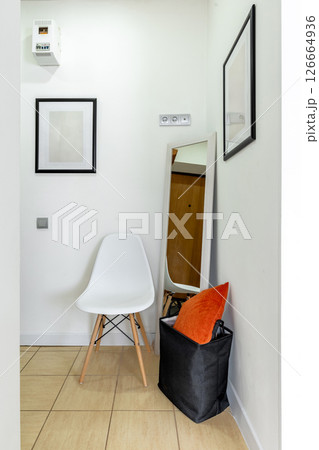 Minimalist Hallway Corner with Chair and Mirror Minimalist Hallway Corner with Chair and Mirror 126664936