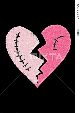 Broken heart with stitches trying to hold two pieces together 126665899