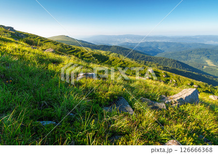 scenic view of alpine landscape in summer. picturesque outdoor background with grass on hill and blue sky with clouds. hiking through wonderful carpathian alps. majestic view from grassy mountain top scenic view of alpine landscape in summer. picturesque outdoor background with grass on hill and blue sky with clouds. hiking through wonderful carpathian alps. majestic view from grassy mountain top 126666368