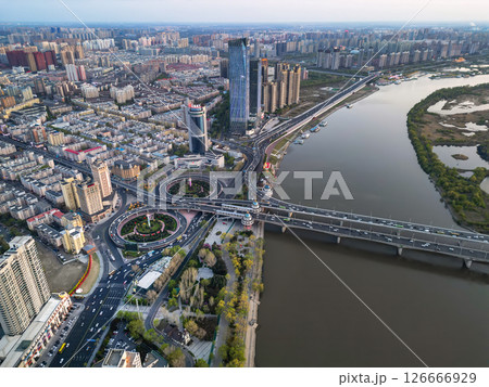 Harbin, CHINA-MAY 05, 2025-Aerial cityscape of Harbin's downtown, is the capital of Heilongjiang, China. It is the largest city of Heilongjiang 126666929