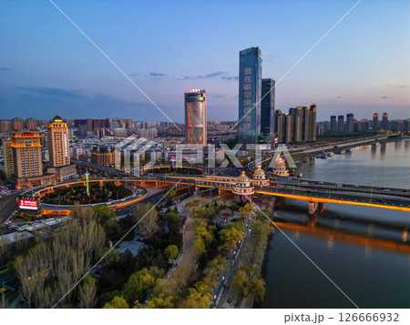 Harbin, CHINA-MAY 05, 2025-Aerial cityscape of Harbin's downtown, is the capital of Heilongjiang, China. It is the largest city of Heilongjiang 126666932