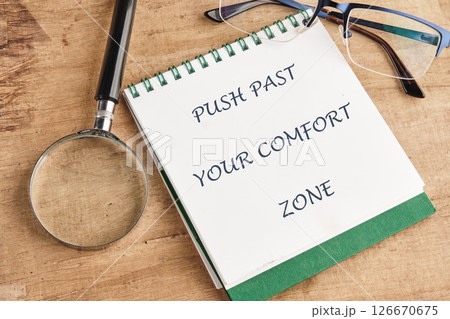 Familiarity, habits, discovering, challenge, uncertainty concept. Words PUSH PAST YOUR COMFORT ZONE 126670675