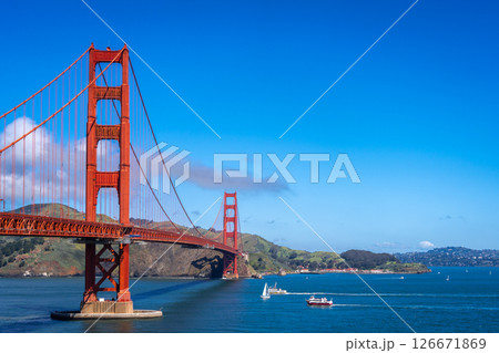 Golden Gate Bridge over blue waters with scenic hills in San Francisco 126671869