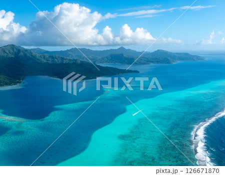 Aerial view of Tahaa island, French Polynesia, with turquoise lagoon and reef 126671870