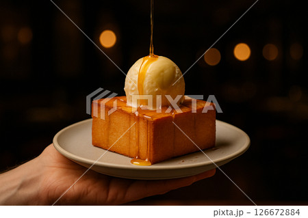 Honey toast with melting ice cream in restaurant 126672884