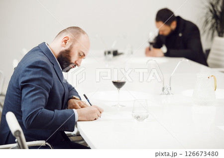 Sommeliers Tasting Wines on Professional Development Training Courses. Advanced Sommelier Certification Class. 126673480