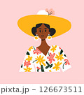 Stylized illustration of a fashionable woman wearing a yellow sunhat and floral dress, posing against a soft pink background.  126673511