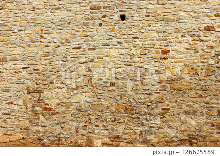 Textured Stone Wall with Natural Colors and Rough Surface Textured Stone Wall with Natural Colors and Rough Surface 126675589