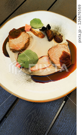 Delicious pork tenderloin with creamy sauce and mushrooms, gourmet dish at cervena lhota castle 126676569