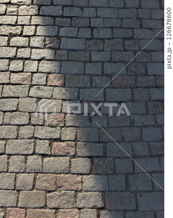 Sunlight illuminating cobblestone street on Charles Bridge in prague, czechia copy space Sunlight illuminating cobblestone street on Charles Bridge in prague, czechia copy space 126676600