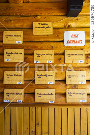 Traditional Slovak food menu displayed on a wooden wall in Pribylina, Slovakia Traditional Slovak food menu displayed on a wooden wall in Pribylina, Slovakia 126676789