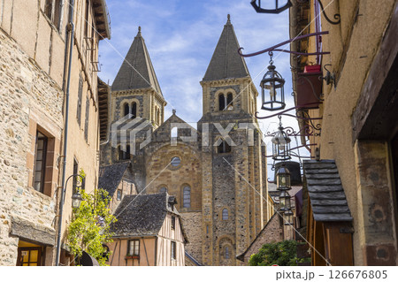 Sainte Foy Abbey rising above traditional houses in Conques en Rouergue, France 126676805