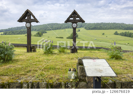World War I Cemetery Number 123 in Luzna Pustki, Poland, featuring wooden crosses marking graves and a descriptive sign providing historical context 126676819