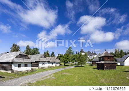 Museum of Liptov Village in Pribylina showcasing traditional Slovak architecture under blue sky Museum of Liptov Village in Pribylina showcasing traditional Slovak architecture under blue sky 126676865