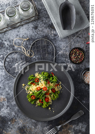 Delicious gourmet dish of roasted broccoli and couscous seasoned with chili pepper 126676891