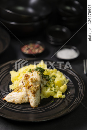 Typical czech cuisine zander fillet on garlic with mashed potatoes Typical czech cuisine zander fillet on garlic with mashed potatoes 126676998