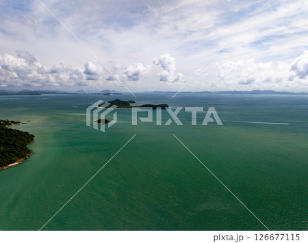 Aerial view landscape sea beach in raining season at Phuket island Thailand. Aerial view landscape sea beach in raining season at Phuket island Thailand. 126677115