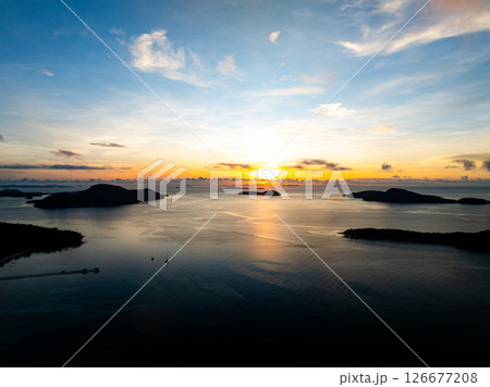 Aerial view sunset sky,Nature beautiful light Sunset or sunrise over sea,Colorful scenery sunset sky background,Amazing clouds and waves in sunrise sky nature light cloud background. Aerial view sunset sky,Nature beautiful light Sunset or sunrise over sea,Colorful scenery sunset sky background,Amazing clouds and waves in sunrise sky nature light cloud background. 126677208