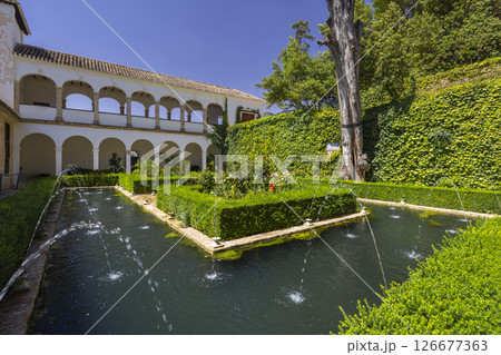 Fountains and gardens decorating the Patio de la Acequia in the Generalife Palace, Granada, Spain Fountains and gardens decorating the Patio de la Acequia in the Generalife Palace, Granada, Spain 126677363