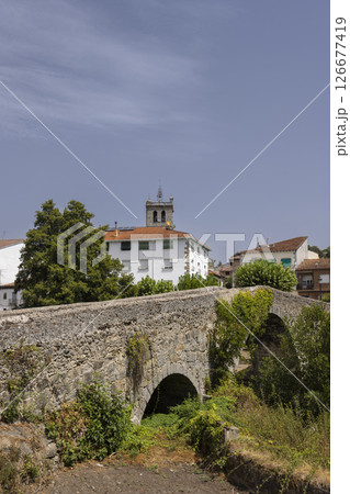 Ancient stone bridge crossing a small stream in Arenas de San Pedro, Spain 126677419