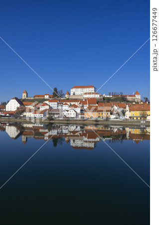 Ptuj Castle reflecting on Drava River in Slovenia under blue sky Ptuj Castle reflecting on Drava River in Slovenia under blue sky 126677449