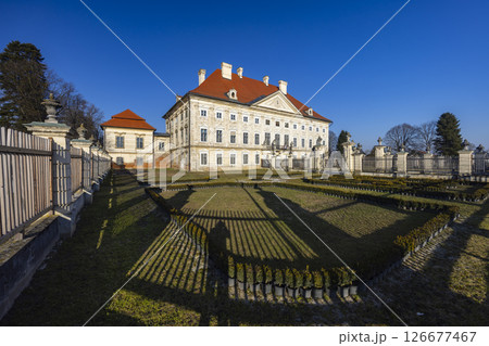 Dornava Mansion casting long shadows in the formal garden in Slovenia Dornava Mansion casting long shadows in the formal garden in Slovenia 126677467