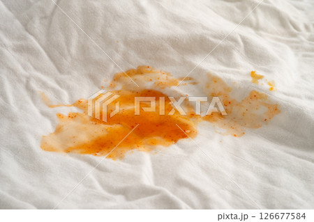 Dirty tomato sauce stain or ketchup on cloth to wash with washing powder, cleaning housework. 126677584