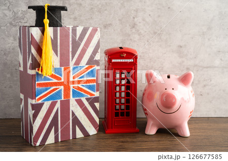 UK flag with graduate hat on english language book. 126677585